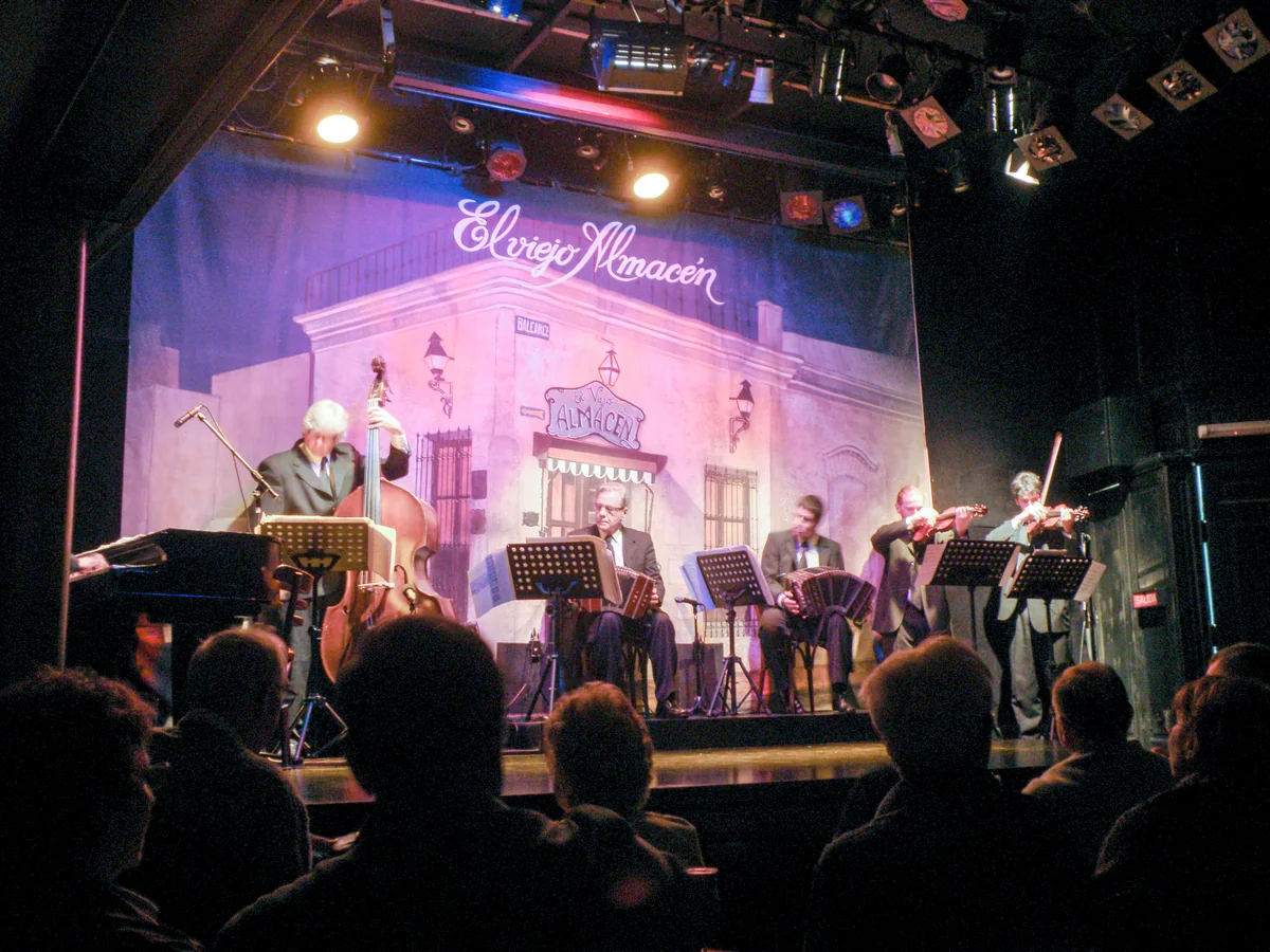 A resident orchestral quintet performing on stage at El Viejo Almacén, San Telmo